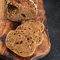Rye bread sunflower seed slices fresh baked goods food healthy eating fresh cooking appetizer meal food snack on the table