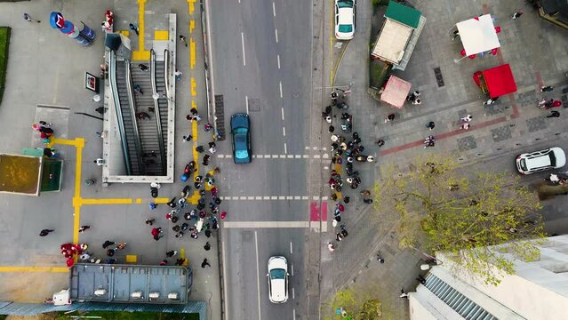 Time-lapse view of people crossing the pedestrian crossing