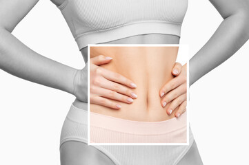 Girl pulls the skin on the abdomen, showing the body fat. Treatment and disposal of excess weight, the deposition of subcutaneous fat. - obrazy, fototapety, plakaty