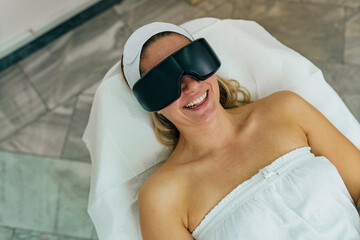 Woman getting ready for laser hair removal. she's wearing protection glasses