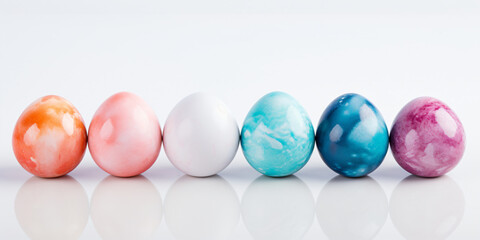 Banner watercolor Multi-colored eggs on a white background, front view. Easter poster with place for text