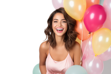 Happy female fashion model in a beautiful dress with balloons