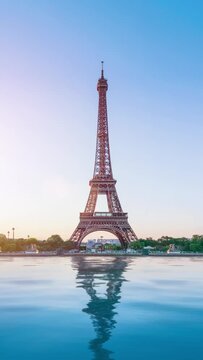 The famous paris eiffel tower in france on a sunny day with sunshine, zoom in camera. vertical video for story and reel