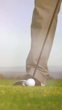 Golf Player plays golf on a beautiful summer morning. wide angle Lens flare Back lite shot - vertical for story and reel
