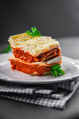 lasagna bolognese meat dish second course eating cooking appetizer meal food snack on the table copy space food background rustic top view