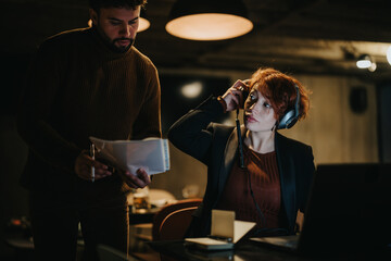 Confident business people collaborating in a creative office, analyzing and strategizing for successful business expansion and growth.