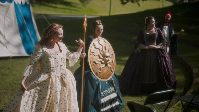 Actresses In Medieval Dresses Doing A Curtsy