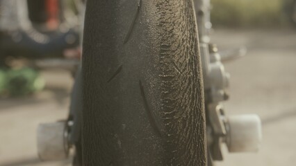 Worn motorcycle wheel close-up. Motorcycle and bicycle tire. Detail macro