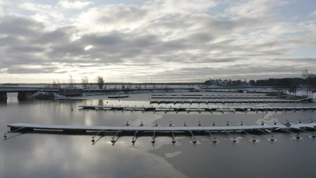Drone footage over the boats port on Sando Island at sunset in Vaasa, Finland