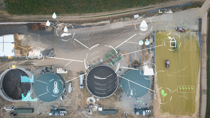 Aerial view of biogas plant farm. Renewable sustainable green energy from biomass, graphics and...