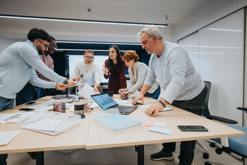 A diverse group of professionals collaborating and sharing ideas in a creative business workshop.