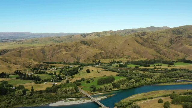 Rural agriculture town of Kurow in Waitaki valley of New Zealand &ndash; aerial 4k pan.
