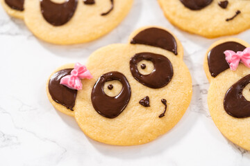 Panda shaped shortbread cookies with chocolate icing