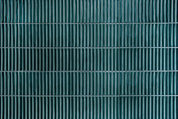 Wall of a bathroom   Bathroom wall covered in green tiles