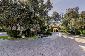 a luxury single-family home with large gardens