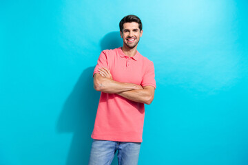 Portrait of cheerful optimistic businessman wear pink t shirt crossed arms confident innovational manager isolated on blue color background