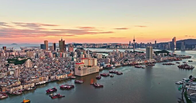 Aerial drone footage of Macau city skyline with modern buildings scenery at dusk