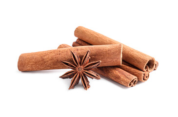 Aromatic cinnamon sticks and anise star isolated on white