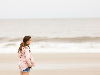 Sad teenage girl on a beach