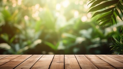 A smooth wooden table foregrounds a soft-focus backdrop of lush tropical plants bathed in sunlight.