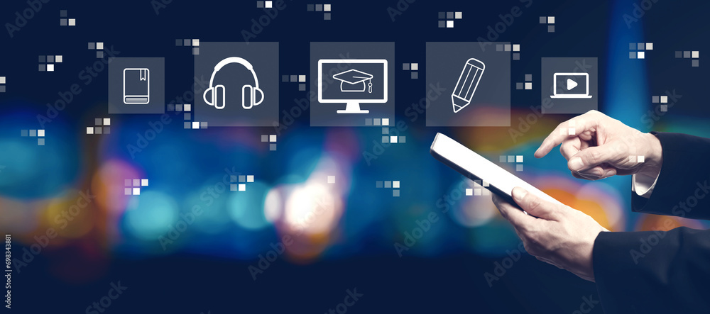 Poster e-learning concept with businessman using a tablet computer at night