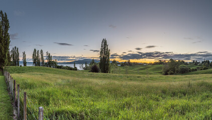 Sunset over Lake Rotorua, North Island New Zealand - obrazy, fototapety, plakaty