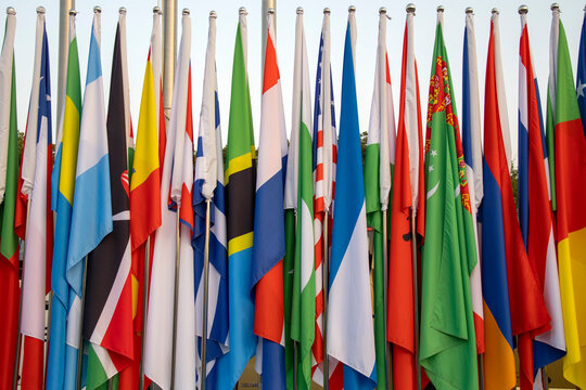 Colorful flags of various nations on the poles