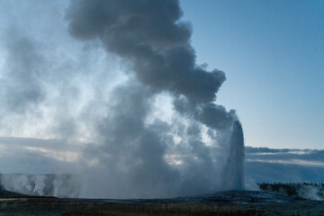 Grand Old Faithful geyser sunset eruption explosion steam Yellowstone National Park observation deck Upper Geyser Basin fall autumn beautiful