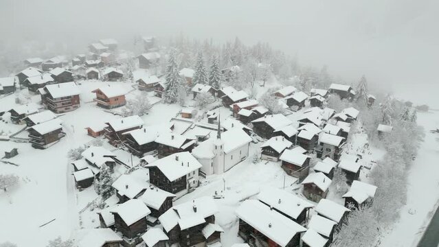 Swiss Village Settlement Blatten Naters Covered With Snow In Switzerland. Aerial Drone Shot