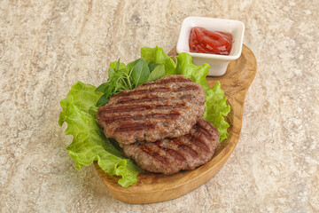 Grilled beef burger cutlet with sauce