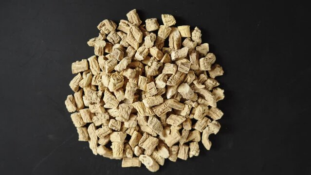 Chinese herb medicine codonopsis root on black background.