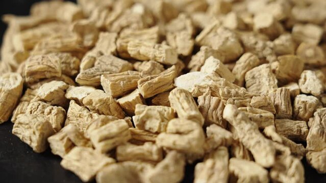 Chinese herb medicine codonopsis root on black background.
