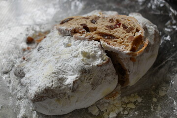 Thinly sliced stollen on stollen loaf