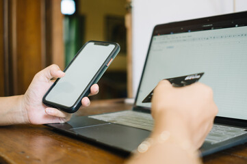 Electronic online financial payments through smartphone, card and laptop. Shotlistbanking