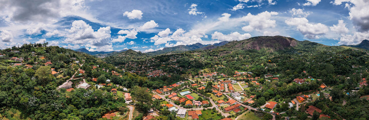 Naklejka na ściany i meble Aerial drone view of the city of Teresopolis in the mountainous region of Rio de Janeiro, Brazil