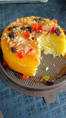 Cake with fruit sauce that was cut and eaten in half