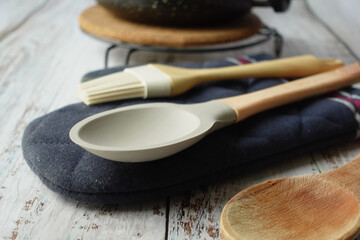 wooden cutlery forks and cooking pan on table 