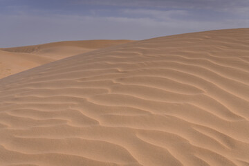 The background image of the sand texture created by the wind, erosion