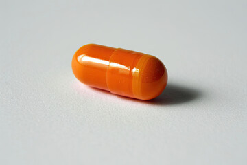 One pill on white background. Medicinal treatment