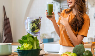Portrait of beauty healthy asian woman making green vegetables detox cleanse and green fruit...