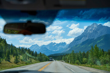 Beautiful view from a car on the Rocky Mountains in Banff National Park in Alberta. Panorama of a...