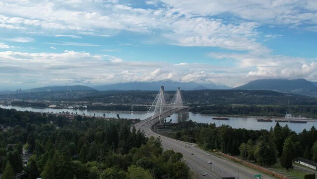 Port Mann Bridge. Vancouver, British Columbia, Canada, over Fraser River, connecting Surrey to Port Coquitlam. 4K Aerial video of the bridge with usual traffic.