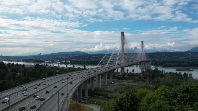 Port Mann Bridge. Vancouver, British Columbia, Canada, over Fraser River, connecting Surrey to Port Coquitlam. 4K Aerial video of the bridge with usual traffic.