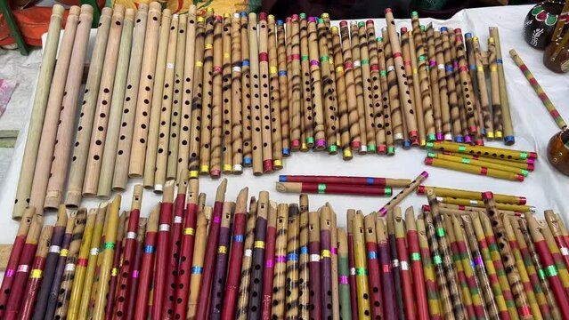 Close up shot of flutes and other artworks at display during the Handicraft Fair in Kolkata, India at daytime.
