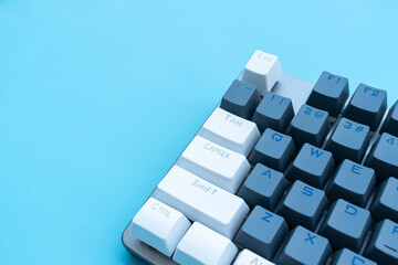 Mechanical keyboard isolated on blue background. After some edits. - obrazy, fototapety, plakaty