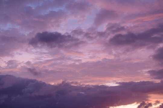 Beautiful lilac clouds on the background of the sunset. Natural Background