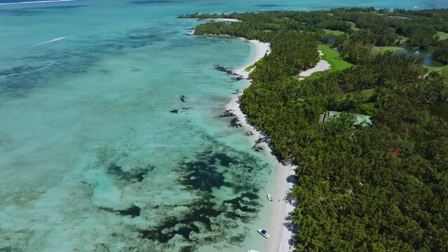 Aerial drone view of Ile Aux Cerfs, Flacq, Mauritius island, Indian Ocean. View of the white sanded beach in the tropical island. Summer holidays destination. Picturesque view of exotic landmark.