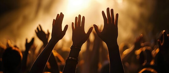 Christian hands lifted in worship, forming a silhouette. - obrazy, fototapety, plakaty