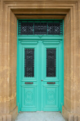 Old historical colorful doors and shutters made of wrought iron and wood. Old historical wooden doors in Cyprus. Doors and shutters of historical stone houses in Nicosia.