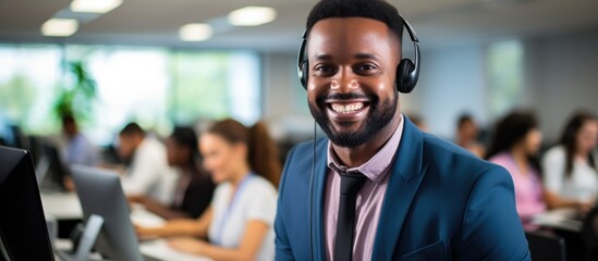 Black man in office for contact, communication, and support in call center, consulting, and computer. Telemarketing, sales, help desk, and technical support in CRM agency. - obrazy, fototapety, plakaty